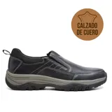 Zapato casual de cuero negro, sin cordones, con elásticos laterales y suela de goma.