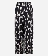 Pantalón de mujer modelo wide leg, con cintura elástica y estampado abstracto en blanco y negro. Confeccionado en tejido piqué de viscosa certificada.