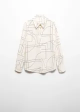 Camisa de manga larga con cuello camisero y cierre de botones frontal. Estampado geométrico en tonos terracota y blanco.