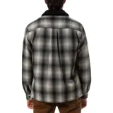 Campera a cuadros gris y negro con cuello de pana negro, cierre con botones y bolsillos frontales con solapa.