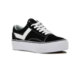 Championes de lona y gamuza color negro con plataforma blanca. Presentan cordones blancos, costuras en contraste y el icónico logo de la marca en el lateral.