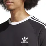 Remera Adidas Adicolor Classic negra con cuello redondo y ribete blanco, mangas cortas con ribete blanco y tres rayas blancas en los hombros. Logo Adidas bordado en el pecho.