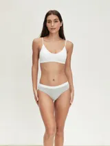 Pack de tres colaless de algodón color gris con cintura elástica blanca.