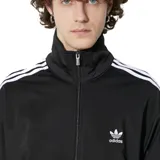 Campera deportiva Adidas Firebird Track Top negra con cierre frontal, cuello alto y tres rayas blancas en las mangas.