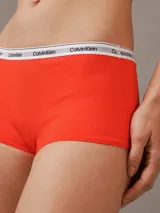 Bombacha hípster color naranja de algodón elástico, con cintura elástica blanca con logo Calvin Klein.