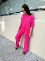 Pantalón palazzo color ladrillo, de morley de viscosa, con cintura elastizada y cordón blanco ajustable.