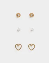 Set de tres pares de aros pasantes dorados: un par con forma de corazón, un par con strass y un par con diseño circular texturizado y strass.
