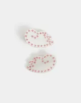 Set de dos hebillas para el pelo con forma de alas y apliques de strass rosas.