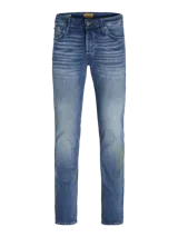 Pantalón de jean azul de corte slim fit, con tiro bajo, rodilla ceñida y pierna ajustada.