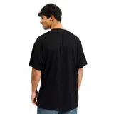 Remera negra de algodón con logo de Billabong estampado en el pecho.