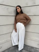 Sweater tejido de punto color rosa con diseño de ochos.