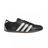 Championes Adidas Tokyo de cuero negro con las tres tiras laterales en blanco y suela marrón.