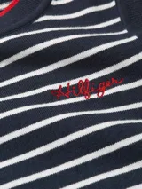Top sin mangas con diseño de rayas horizontales en azul marino y blanco, cuello redondo y logo de Tommy Hilfiger bordado en el pecho.