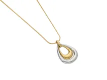 Collar de acero con baño de oro combinado y dije en forma de lágrima.