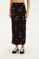 Falda midi plisada con estampado tropical de cócteles, cintura alta y corte clásico. Confeccionada en poliéster.