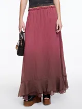 Falda larga color beige con degradé a verde oliva, cintura elástica y volado en el ruedo.