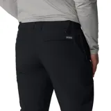 Pantalón negro de corte recto, con cintura ajustable con cordón, rodillas articuladas, bolsillos para las manos, bolsillo de seguridad con cremallera, detalle de refuerzo, detalle de anilla en D, bolsillos traseros, trabilla para cinturón multifuncional.