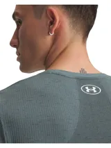 Remera deportiva Under Armour Vanish Seamless para hombre, color azul jaspeado con logo blanco en el pecho. Confeccionada con tejido transpirable y tecnología anti-olor.