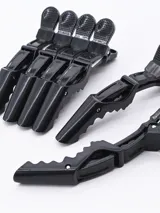 Pack de seis pinzas negras para el pelo, con agarre antideslizante y resorte metálico.