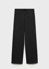 Pantalón de punto color beige, de corte wide leg, tiro medio y cintura elástica.