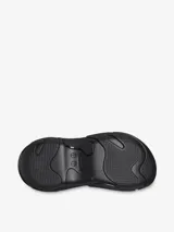 Zueco negro con plataforma, suela exterior de goma exagerada y orificios para charms Jibbitz.
