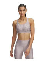 Top deportivo Under Armour con estampado floral en tonos rosa y amarillo sobre fondo negro. Cuenta con tirantes cruzados en la espalda y banda elástica con el logo de la marca en el contorno inferior.