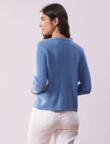 Cardigan tejido negro de algodón, marca Ninety. Escote a la base y abertura central con botones metálicos dorados. Delantera con bolsillos simulados.
