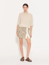 Sweater tejido con lurex, color beige, de silueta holgada y estilo remerón, con mangas cortas.