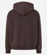 Saco con cierre frontal, capucha con cordón ajustable y bolsillos canguro. Diseño liso de corte holgado (boxy).