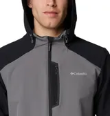 Campera tipo softshell con capucha, de color gris y negro. Presenta un diseño bicolor con el cuerpo principal gris y los hombros/mangas superiores en negro. Cuenta con cierre frontal de cremallera, bolsillos laterales con cremallera y puños elásticos.
