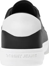 Zapatillas Tommy Jeans negras de piel con suela cupsole blanca, cierre de tres tiras de velcro y panel blanco a contraste en el talón.