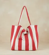 Bolso tote de tela con rayas verticales color azul marino y blanco, con doble asa de hombro.