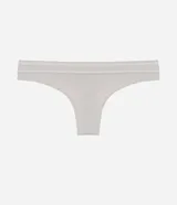 Bombacha de bikini color beige claro, confeccionada en poliamida con tecnología seamless y textura. Presenta un corte bikini clásico y un borde liso.