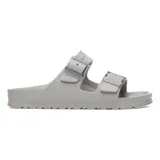 Sandalias Birkenstock Arizona SB EVA de goma color gris claro, con doble tira y hebillas ajustables transparentes.