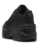 Championes Puma Karmen X-TRA color negro con plataforma gruesa y detalles dorados.