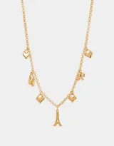 Collar corto dorado con cadena de eslabones y dijes colgantes: moño, zapatos de ballet, corazón y la Torre Eiffel.