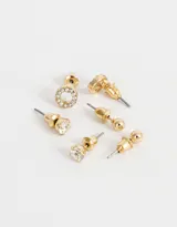 Set de tres pares de aros pasantes dorados con strass. Incluye un par de aros tipo bolita, un par con strass transparente y un par con strass y centro nacarado.