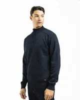 Sweater negro de punto con cuello alto y cierre de media cremallera.