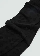 Medias de lycra negras con estampado de leopardo.