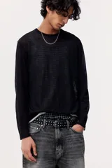 Pantalón de jean gris oscuro con efecto lavado, corte holgado, tiro bajo y cinco bolsillos.