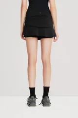 Minifalda color crema con short interno y tres volados horizontales.