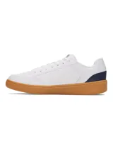 Championes urbanos Under Armour UA Official, color blanco con logo en azul y suela color caramelo.