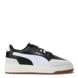 Championes urbanos Puma Shuffle Downtown, color negro con detalles en blanco y suela color caramelo.