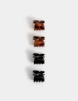 Set de cuatro mini broches para el pelo en forma de mariposa, dos en color carey y dos en color negro.