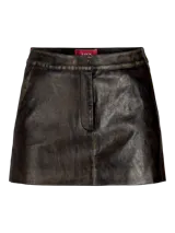 Minifalda negra de cuero sintético con efecto gastado, corte recto y cierre lateral invisible.