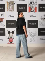 Remera negra de corte holgado con estampado frontal de Úrsula de La Sirenita, con el texto "Unfortunate Souls" en tipografía gótica morada.