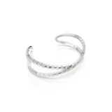Brazalete con baño de rodio, diseño inspirado en el infinito, engastado con cristales de Swarovski Zirconia transparentes.