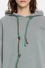 Sudadera rosa de algodón con capucha ajustable con cordones, corte oversize, manga larga y logo bordado.