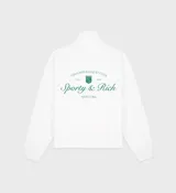 Buzo blanco de algodón con medio cierre frontal, cuello polo, corte ligeramente oversize, largo corto y dos bolsillos laterales. Estampado frontal con el logo de la marca Sporty & Rich en color verde.