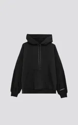 Canguro negro oversize de frisa premium con capucha ajustable y puños elastizados.